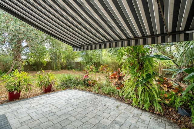 view of patio featuring fence