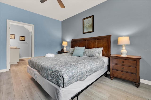 bedroom with ceiling fan, connected bathroom, and light hardwood / wood-style flooring