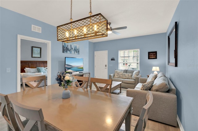 dining area featuring ceiling fan and light hardwood / wood-style flooring