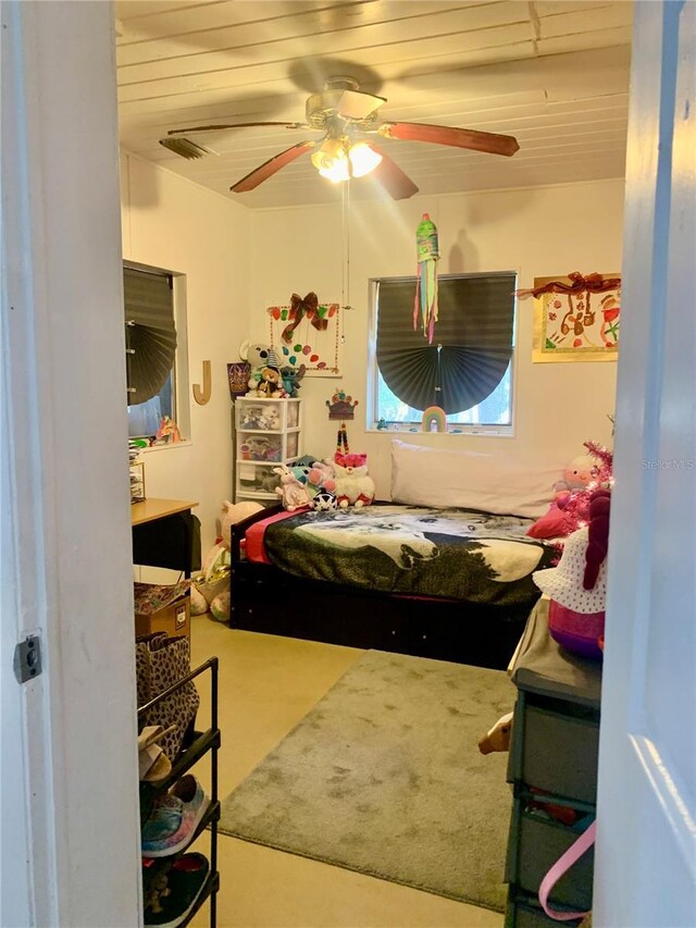 bedroom featuring wood ceiling and ceiling fan
