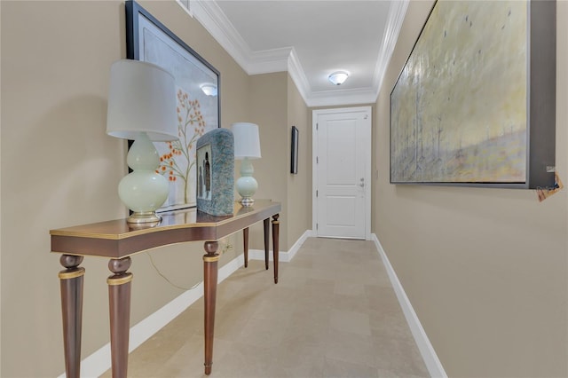 corridor featuring baseboards and ornamental molding