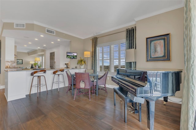 sitting room featuring crown molding and dark hardwood / wood-style floors