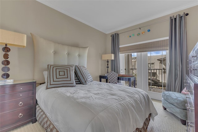 carpeted bedroom featuring access to exterior and ornamental molding