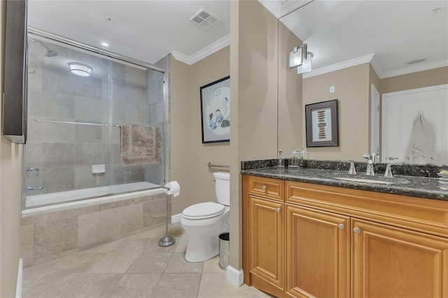 full bathroom with bath / shower combo with glass door, ornamental molding, vanity, toilet, and tile patterned floors