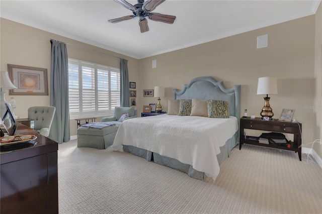 carpeted bedroom featuring crown molding and ceiling fan