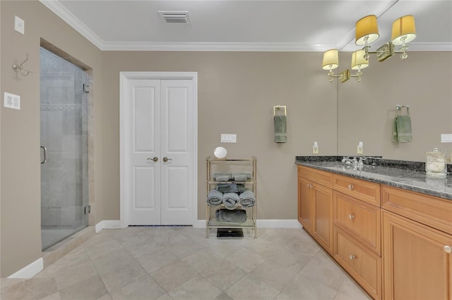 bathroom featuring tile patterned flooring, vanity, ornamental molding, and walk in shower