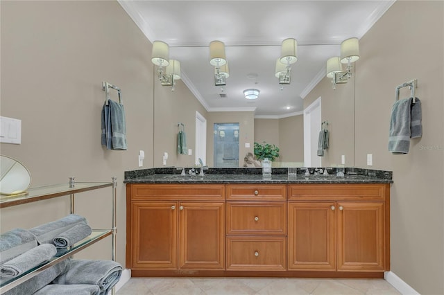 bathroom with crown molding, vanity, and tile patterned floors