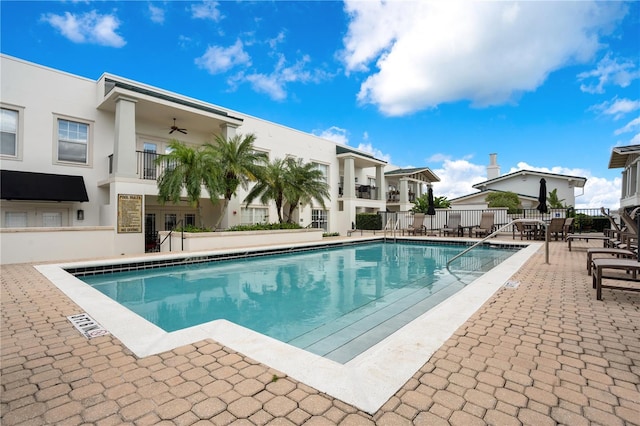 view of pool featuring ceiling fan and a patio area