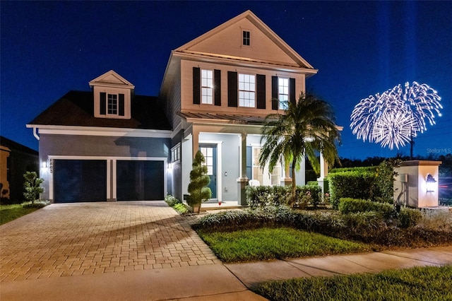 view of front of property featuring a garage