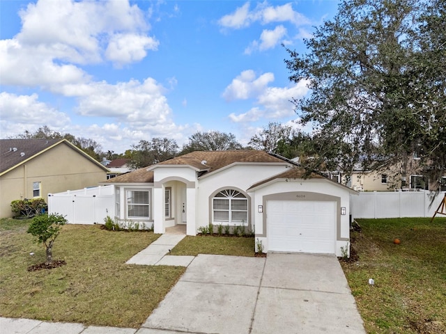 view of front of house with a garage and a front yard