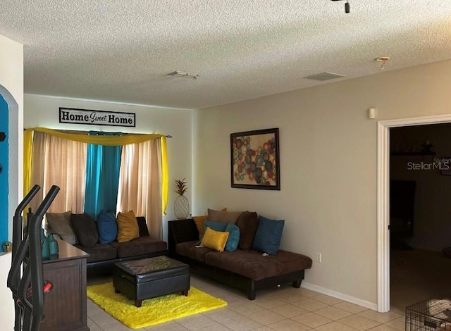 tiled living room with a textured ceiling