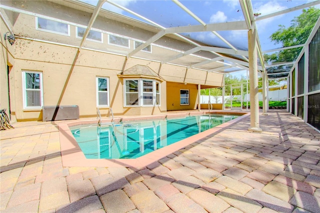 view of pool with a lanai and a patio area