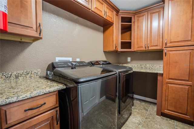 laundry area with cabinets and washer and dryer