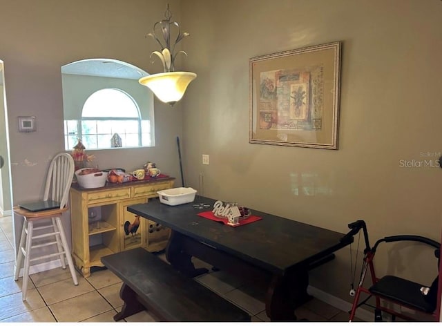 dining space with light tile patterned floors