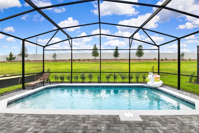 3373 Lilac Way, Davenport, FL 33897 - view of swimming pool with a yard, a patio area, and glass enclosure