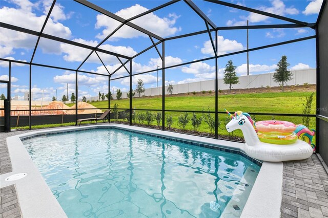 3373 Lilac Way, Davenport, FL 33897 - view of pool featuring a patio area, glass enclosure, and a lawn