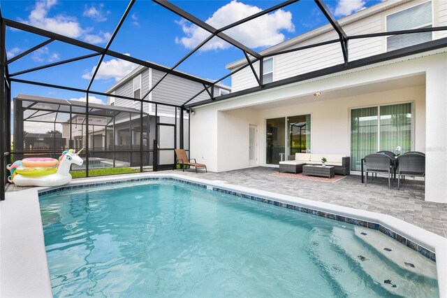 3373 Lilac Way, Davenport, FL 33897 - view of pool featuring a lanai, an outdoor hangout area, and a patio