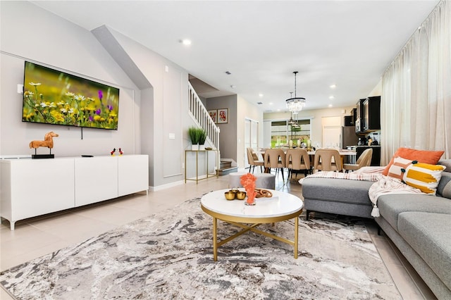 3373 Lilac Way, Davenport, FL 33897 - living room featuring a chandelier and light tile patterned floors