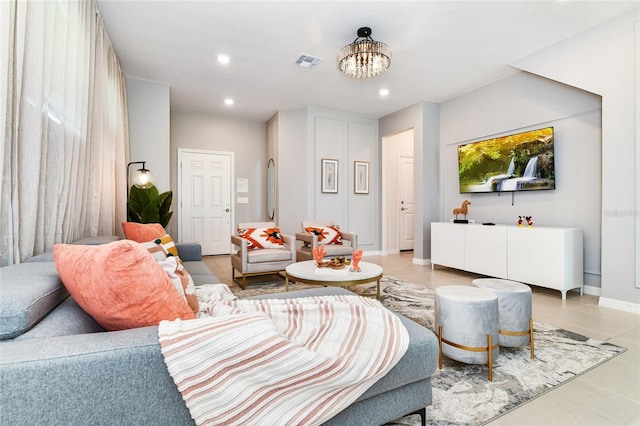 3373 Lilac Way, Davenport, FL 33897 - living room with a notable chandelier and light tile patterned flooring