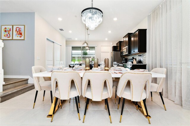 3373 Lilac Way, Davenport, FL 33897 - dining room featuring light tile patterned floors and a chandelier