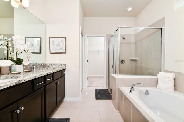 3373 Lilac Way, Davenport, FL 33897 - bathroom with plus walk in shower, vanity, and tile patterned floors
