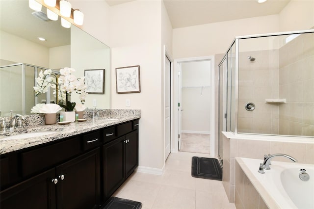 3373 Lilac Way, Davenport, FL 33897 - bathroom featuring vanity, tile patterned flooring, and independent shower and bath