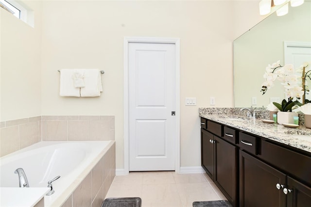 3373 Lilac Way, Davenport, FL 33897 - bathroom with vanity, tiled bath, and tile patterned flooring