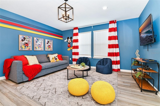 3373 Lilac Way, Davenport, FL 33897 - living room featuring hardwood / wood-style flooring and an inviting chandelier