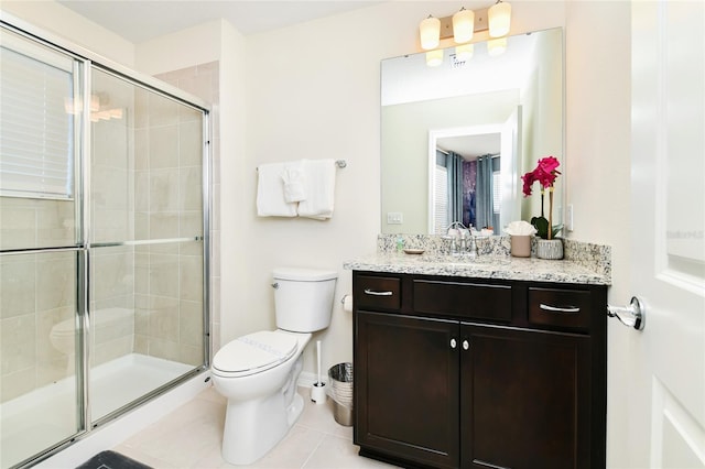 3373 Lilac Way, Davenport, FL 33897 - bathroom with vanity, toilet, an enclosed shower, and tile patterned flooring