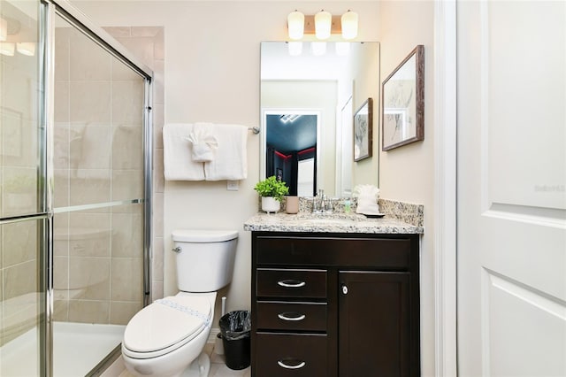 3373 Lilac Way, Davenport, FL 33897 - bathroom featuring vanity, a shower with door, and toilet