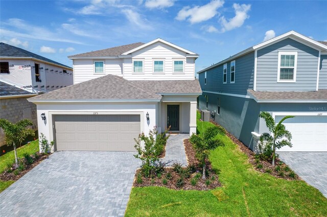 3373 Lilac Way, Davenport, FL 33897 - view of front facade featuring a front lawn