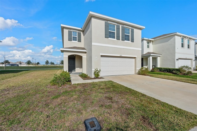 traditional home featuring driveway, a front lawn, an attached garage, and stucco siding