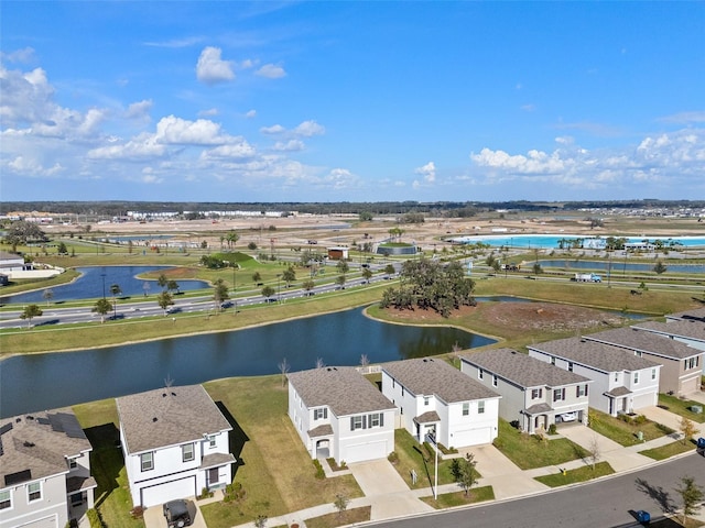 bird's eye view featuring a residential view and a water view