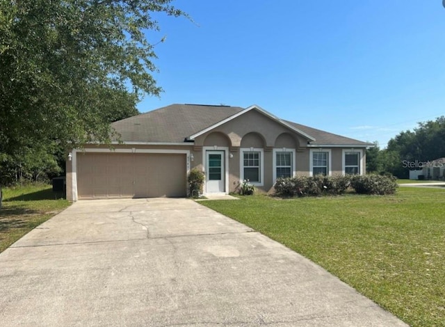 ranch-style home with a garage and a front yard