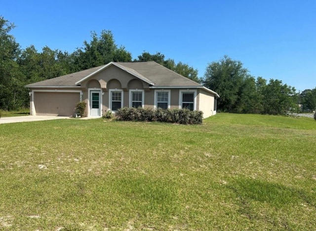 ranch-style house with a garage and a front lawn