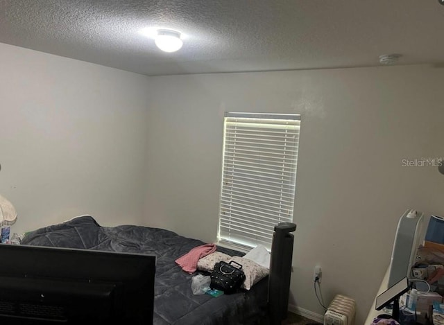 bedroom with a textured ceiling