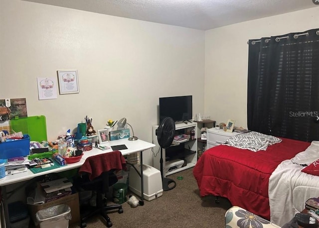 bedroom featuring a textured ceiling and carpet flooring