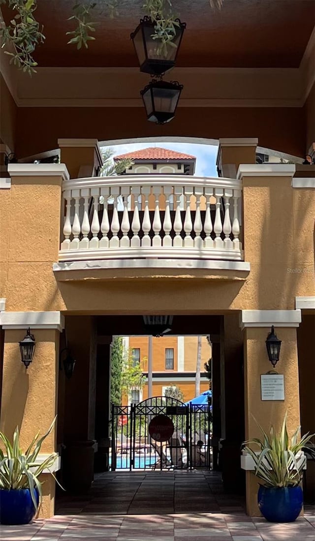 exterior space featuring a balcony and stucco siding