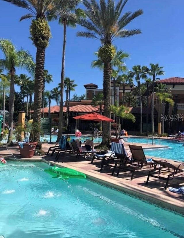 community pool with a patio