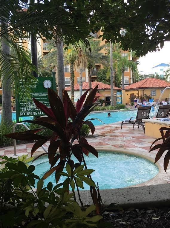 community pool featuring a patio area