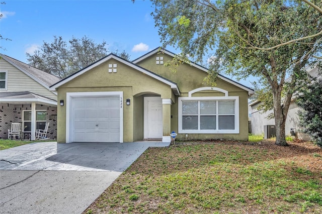 ranch-style home with an attached garage, central AC, concrete driveway, and stucco siding