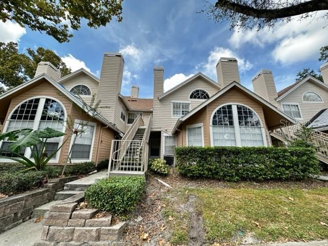 back of property with stairway