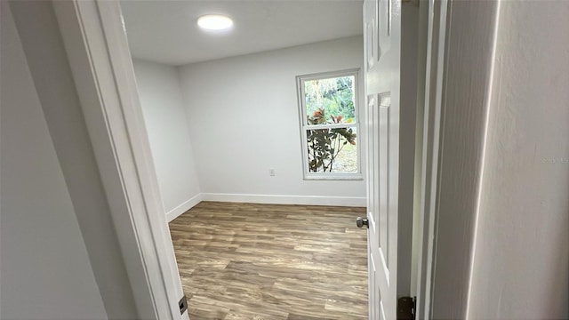 spare room featuring hardwood / wood-style flooring