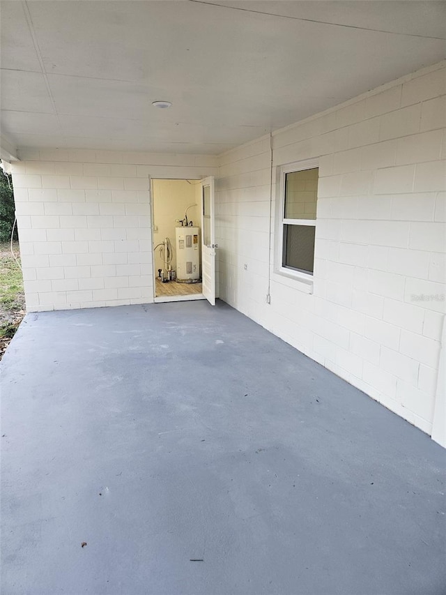 view of patio featuring water heater