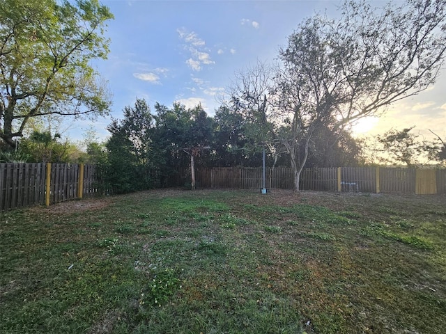 view of yard at dusk