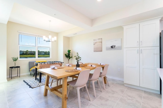 tiled dining space with an inviting chandelier