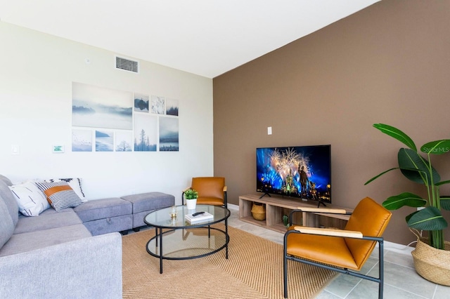 living room with tile patterned floors