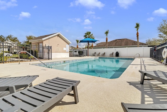 view of swimming pool with a patio area