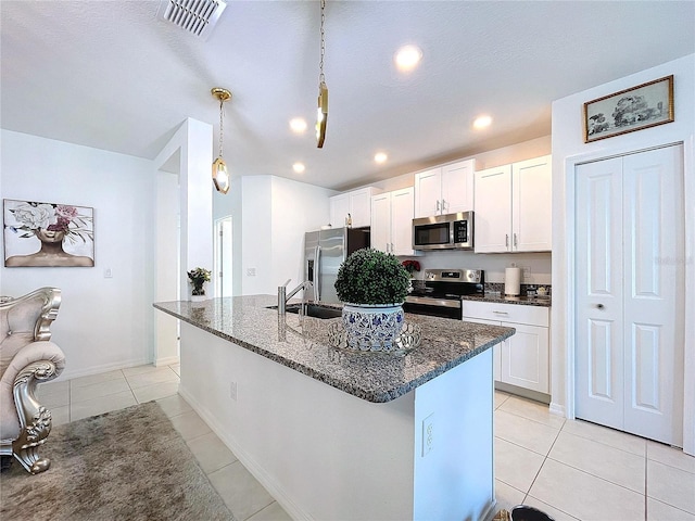 kitchen with white cabinetry, visible vents, appliances with stainless steel finishes, and a sink