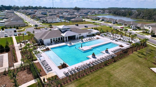 view of swimming pool featuring a water view